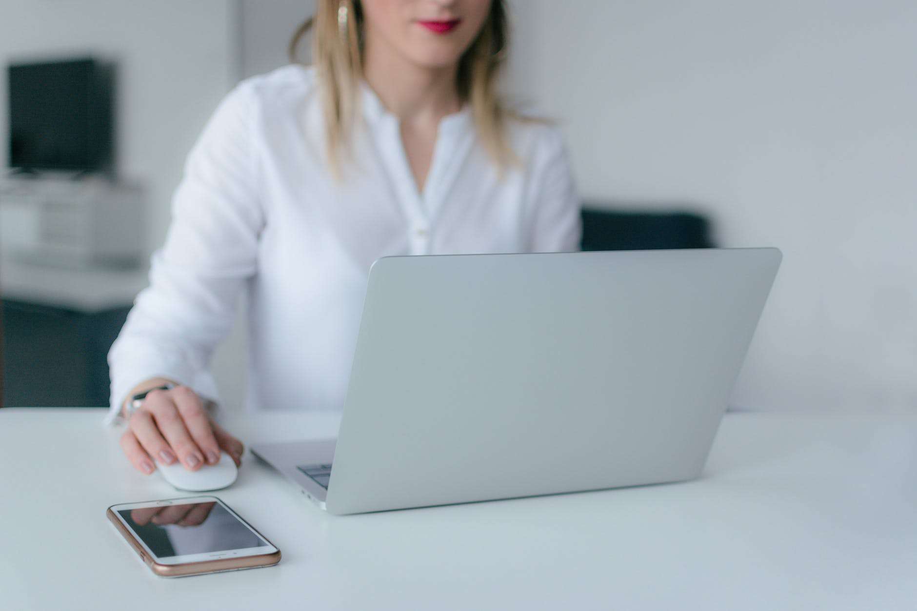 A person using a laptop on a table