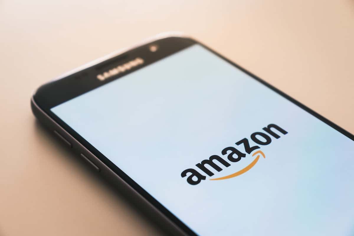 A logo of Amazon displayed on a phone screen