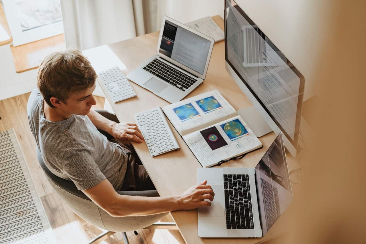 A man looking through web pages on his computer