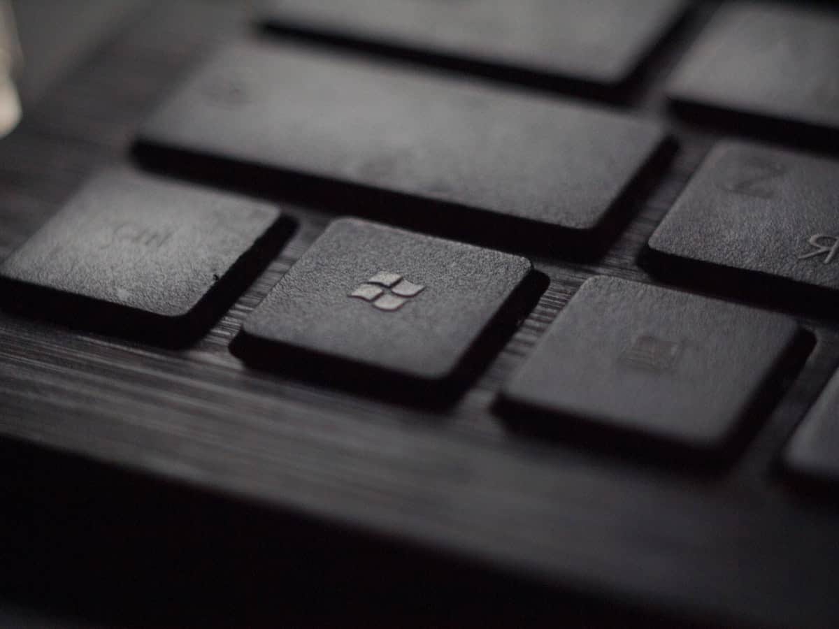 A keyboard with a Microsoft logo on it