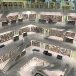 Thousands of books are safely stored in a well-lit library.