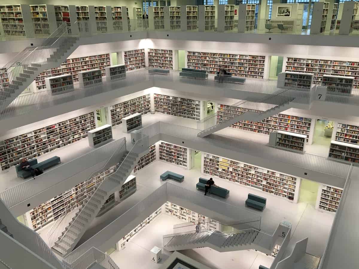 Thousands of books are safely stored in a well-lit library.