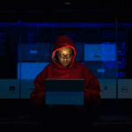 A woman wearing a hoodie sits in front of a tablet women in STEM